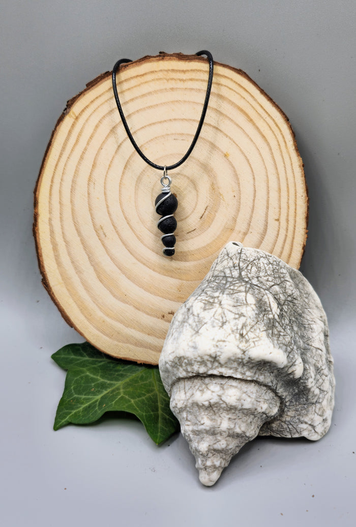 4 descending Lava stone bead pendant