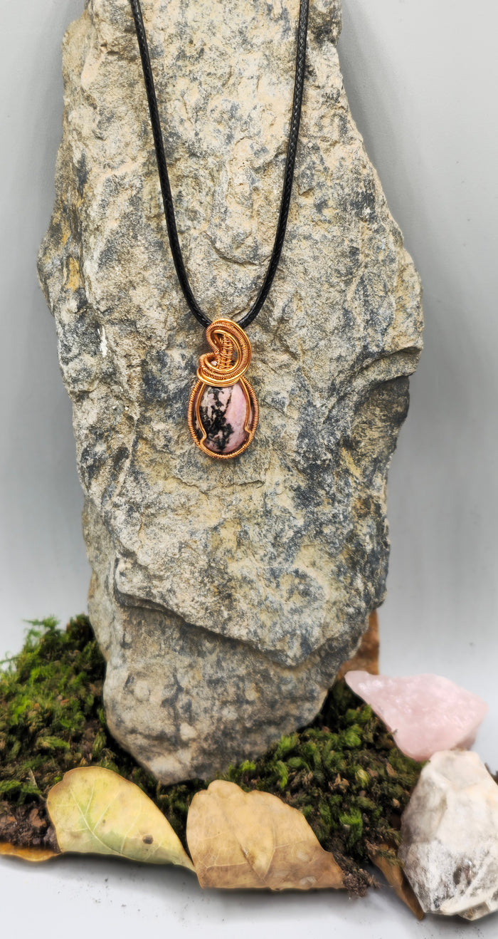 Copper-coloured wire wrapped stone pendant