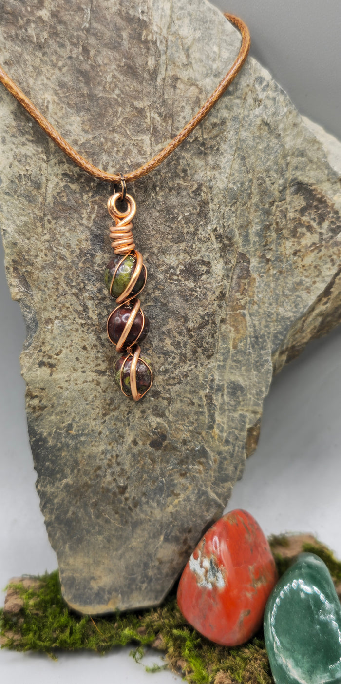 Dragon Blood stone delicate wrapped pendant