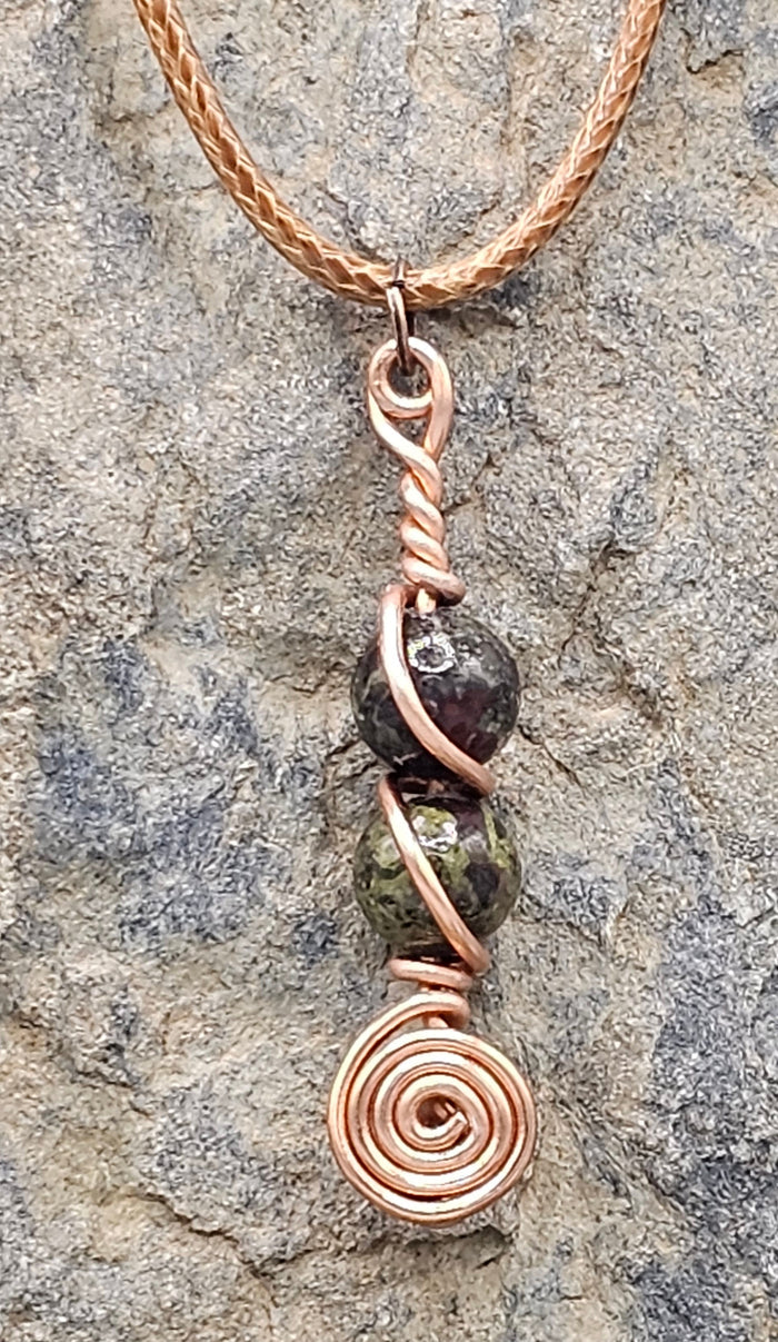 Dragon Blood stone spiral pendant