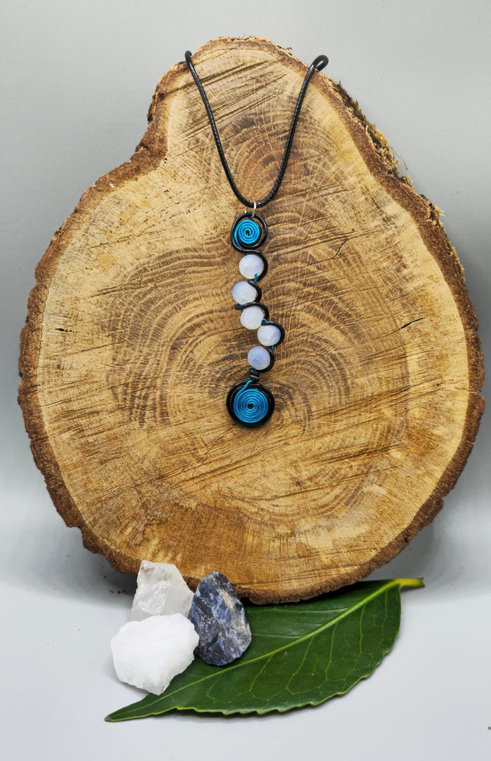 Electric blue, or pink, and black 5 bead twist pendant.