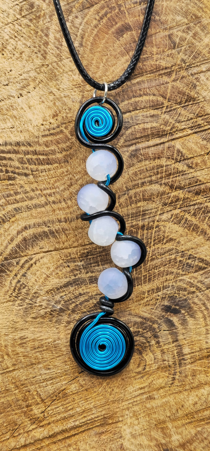 Electric blue, or pink, and black 5 bead twist pendant.