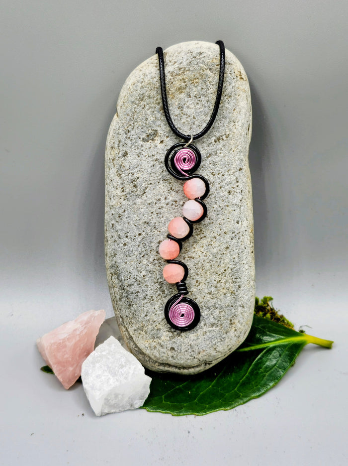Electric blue, or pink, and black 5 bead twist pendant.