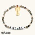Team Gleason "End ALS" beaded bracelet in grey and white tones with crystal accents and a gold tag charm.