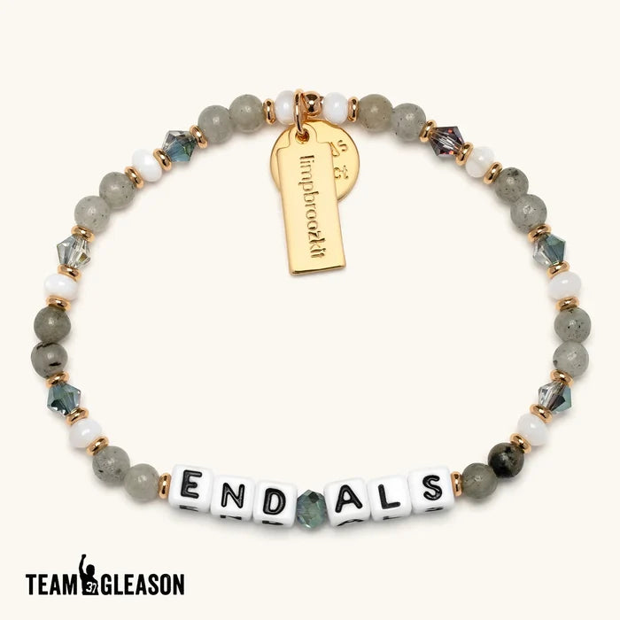Team Gleason "End ALS" beaded bracelet in grey and white tones with crystal accents and a gold tag charm.