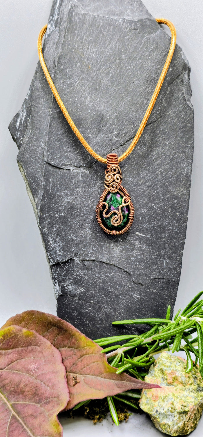 Intricate brown wire-wrapped stone pendant