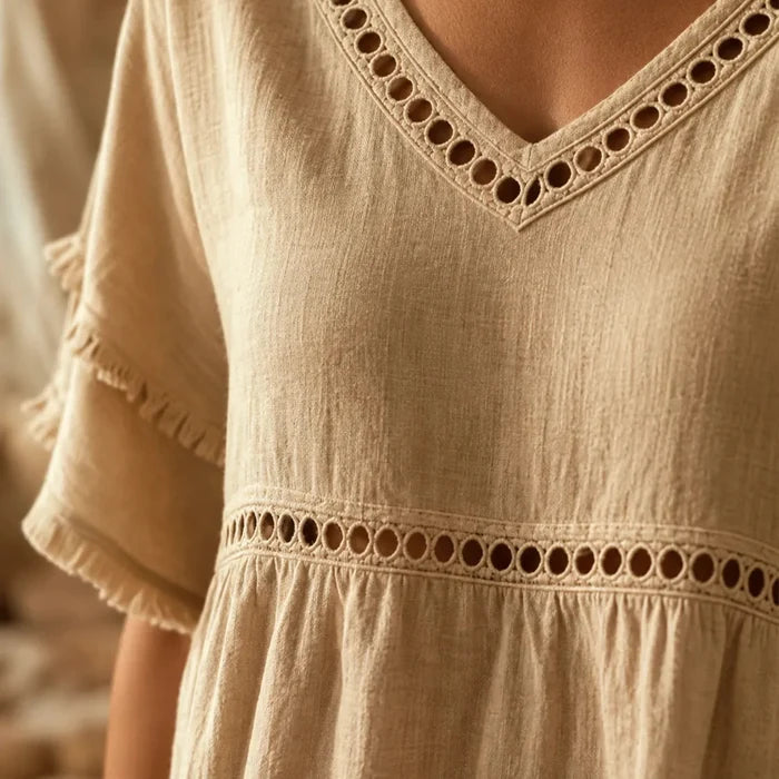 Meloria – Bohemian Babydoll Top with Eyelet Cutouts and Fringe Hem