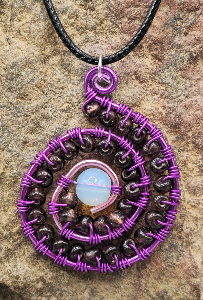 Opalite and purple beaded spiral pendant