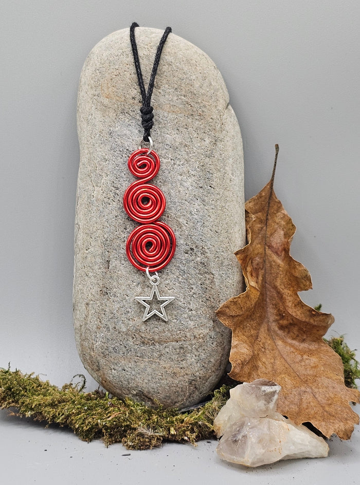 Red spirals star pendant