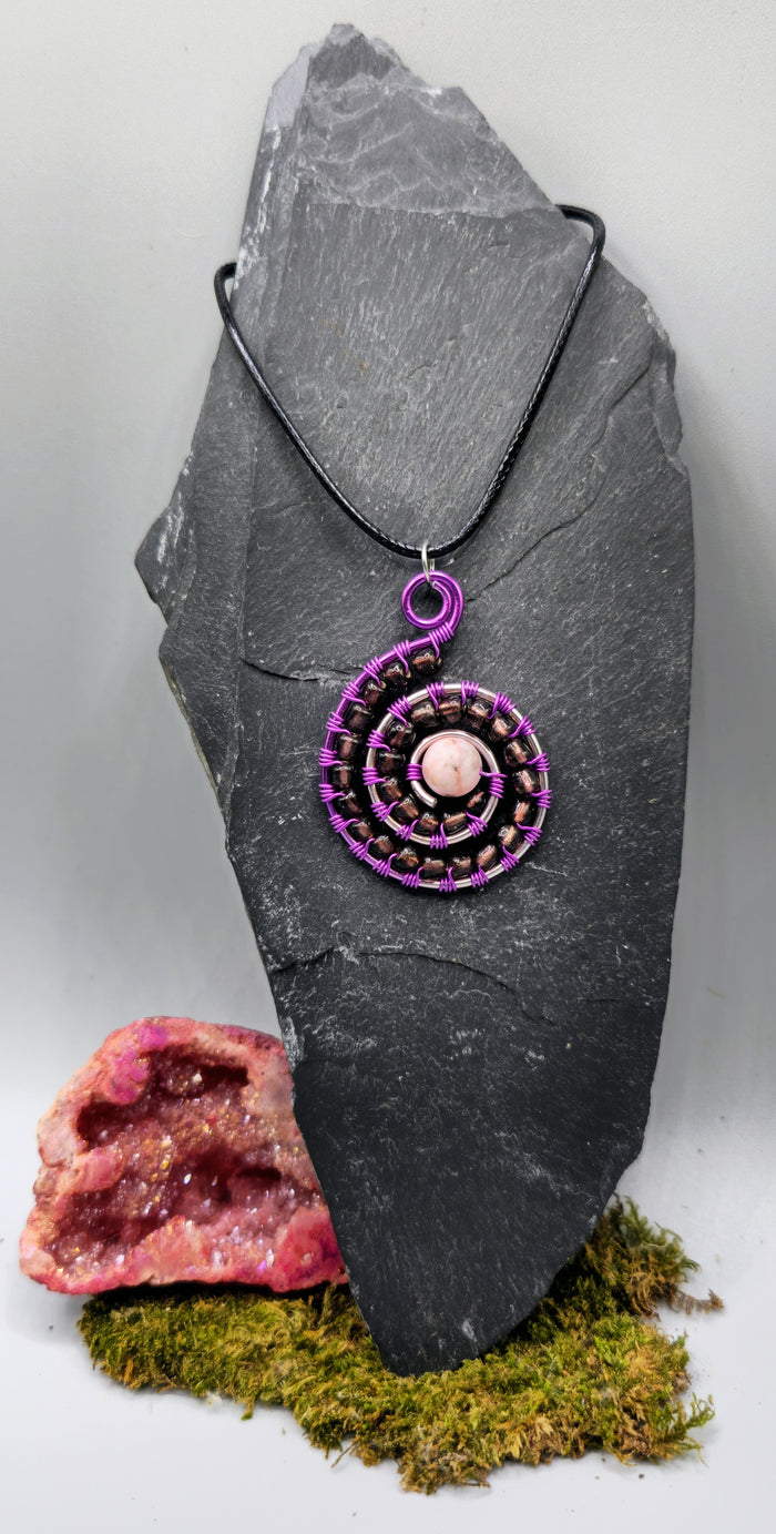 Rhodonite and purple bead spiral pendant