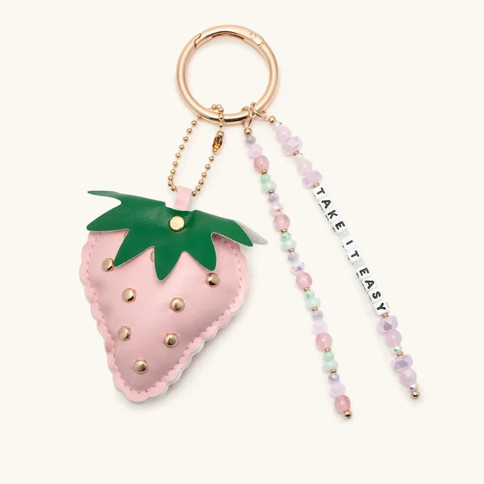 Take It Easy Strawberry Bag Charm with lavender and mint beaded tassel on gold ring clip