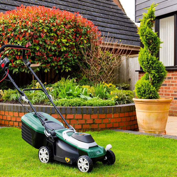 Webb Classic 33cm Elec Rotary Mower with Rear Roller in garden