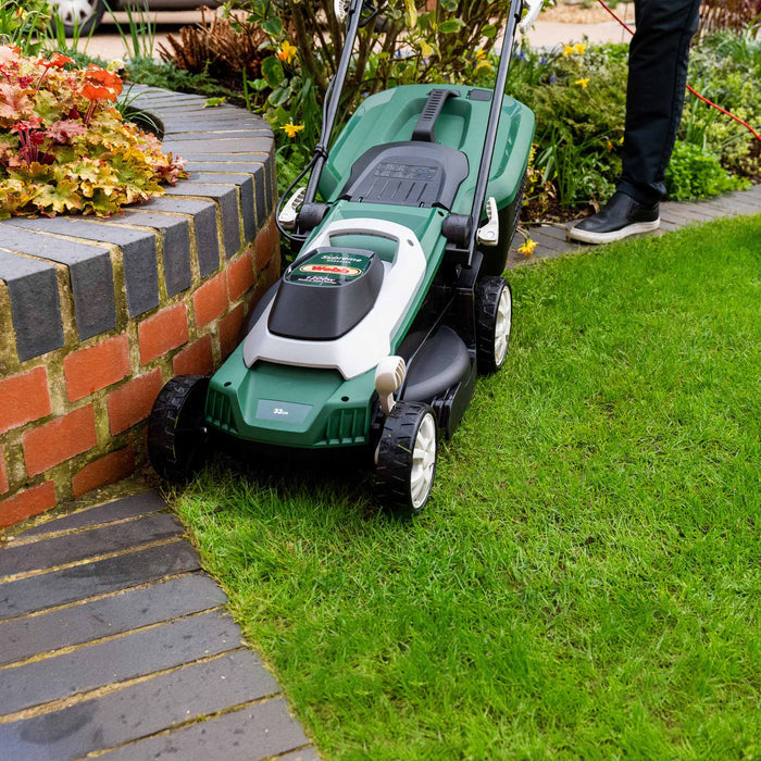 Webb Classic 33cm Elec Rotary Mower with Rear Roller in garden