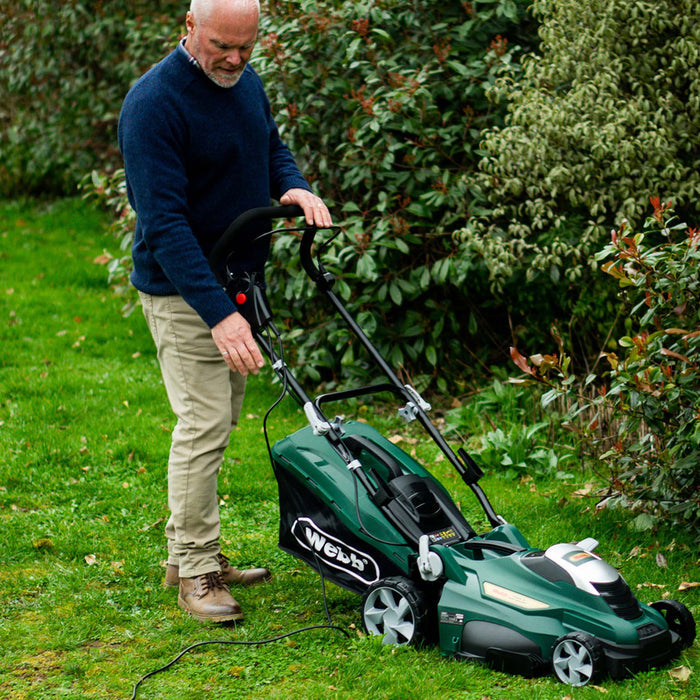 Webb Classic 40cm Electric Rotary Lawnmower being used by man